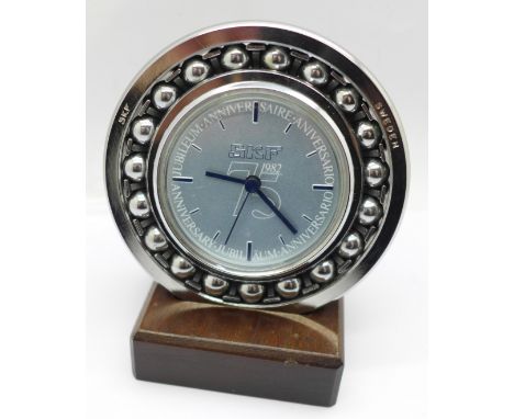 A novelty SKF of Sweden ball bearing clock on stand, 75th anniversary 1982, (battery movement) 