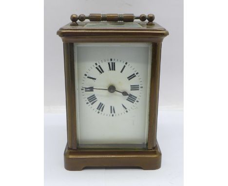 A French brass and four glass sided carriage clock 