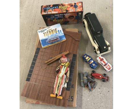 Comprising 3 Scalextric slot cars, a mini railway set, a Pelham puppet, wooden car boxed foam disc shooter, Micro Machine Tit