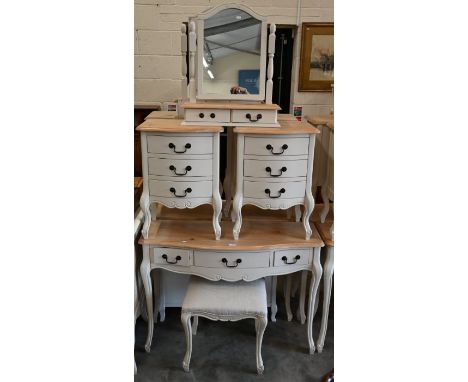 A pine top off-white painted serpentine three drawer side table to/with a matching pair of three drawer bedside chests, a dre