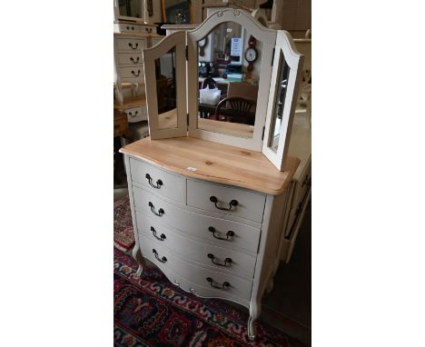 A pine top off-white painted serpentine chest of two short over three long drawers, 80 cm w x 40 cm x 89 cm h to/with a table