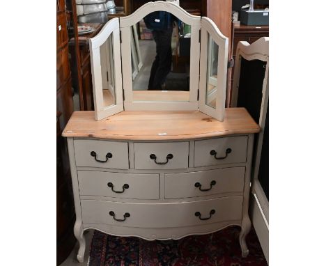 A pine top off-white painted serpentine chest of two short over two over one long drawer, to/with a matching folding dressing