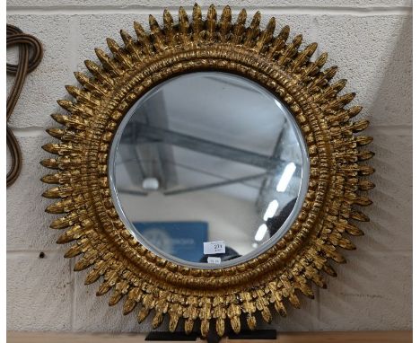 A circular gilt framed star-burst mirror, 60 cm dia.