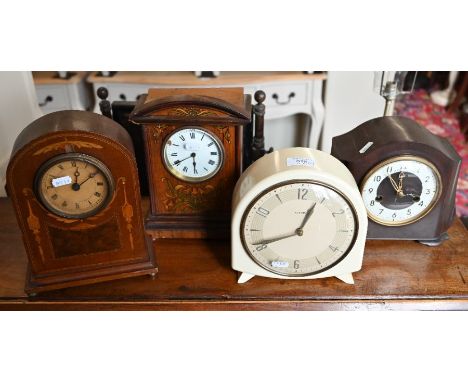 A Smiths mantel clock in cream plastic case, 19 cm high to/w a bakelite mantel clock and two inlaid mantel clocks (4)