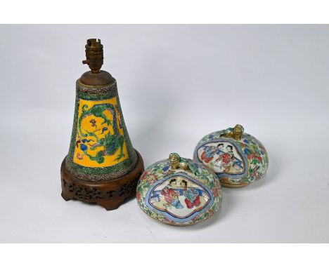 A Chinese porcelain conical dragon lamp, painted in green, yellow, blue and aubergine enamels with reticulated hardwood base,