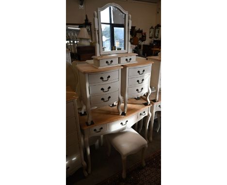 A three drawer pine top side table/desk to/w a stool, a pair of matching three drawer bedside chests and a mirror (5)