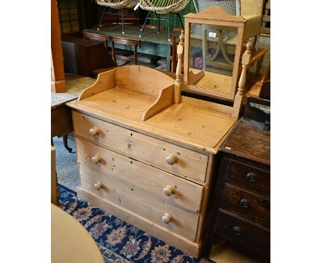 A pine three drawer dressing chest with swing mirror above