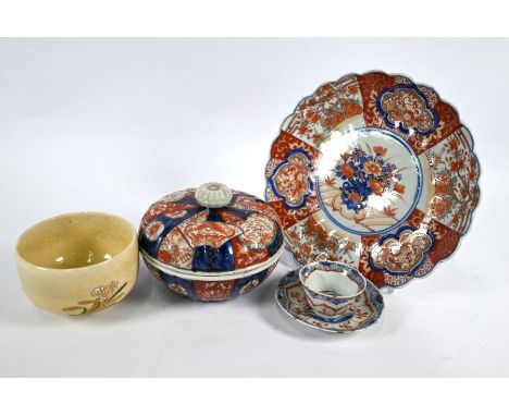 An 18th century Chinese floriform cup and saucer, decorated in underglaze blue and iron red enamels, Qing period, to/w Japane