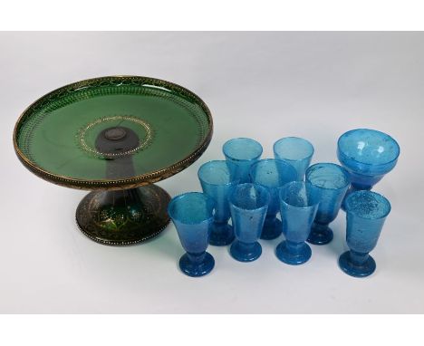 A Bohemian green glass large tazza with gilt and enamel decoration, 31 cm diam to/w a set of eight Middle Eastern pale blue b