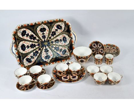 A Victorian Derby Crown Porcelain Co Ltd cabinet tray decorated with Imari design, 1888, 48 x 32 cm to/w ten tea cups with ei