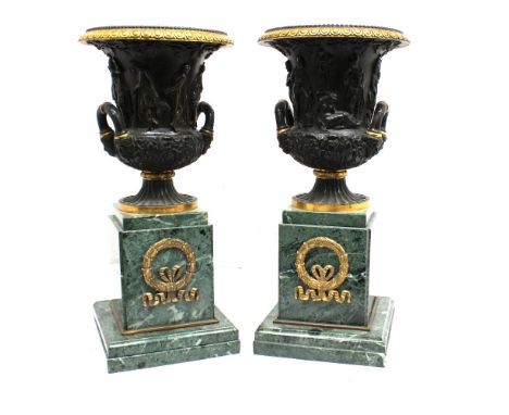 A pair of 19th century large bronze campana shaped urns, of classical design with gilt interior rims and exterior egg and dar