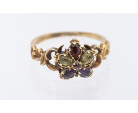 A 19th century stone set ring, comprising a floral motif set with pear cut amethyst, chrysoberyl and amethyst, set to the cen