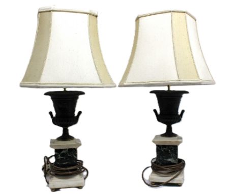 A pair of 20th century, 19th century style lamp bases, with bronzed metal campana shaped urn with twin handles and figures an