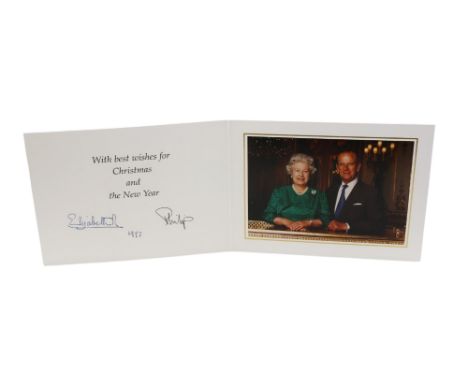 HM Queen Elizabeth and HRH The Duke of Edinburgh; a signed (autopen)1997 Christmas card, with twin gilt Royal cyphers to cove