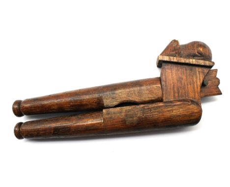 Robert 'Mouseman' Thompson: a pair of novelty oak nutcrackers, with lever-action and traditional carved mouse to top, approx.