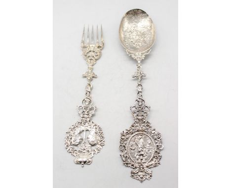 An early 20th Century Hanau silver large presentation spoon and fork, spoon with oval terminal chased with figure of Minerva 
