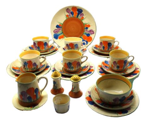 Clarice Cliff - a part tea service in 'Crocus' pattern to include; sugar bowl, milk jug, five matching cups and six saucers, 