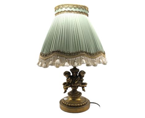 An early 20th century gilt metal ornate converted lamp base (were candlesticks), having elaborate cast knopped stem with two 