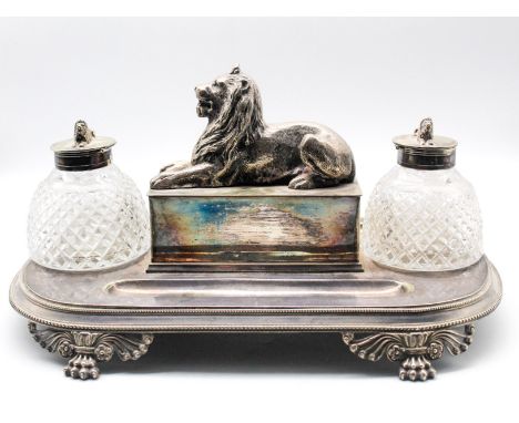 A 19th Century, circa 1840, Sheffield plate oblong ink stand, with beaded border on four paw and foliate supports, the centre