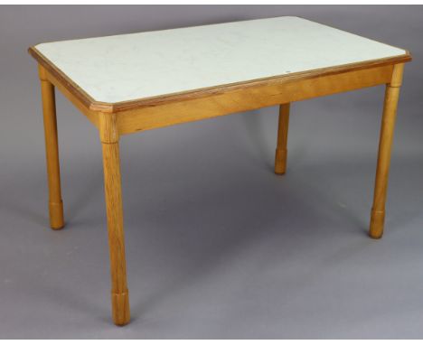 A beech-finish kitchen table inset laminate top, &amp; on four turned legs, 44” wide x 28” high; together with a pair of elbo