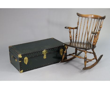 A Spindle-back rocking chair with a hard seat, &amp; on turned supports; together with a travelling trunk, 36” wide. 