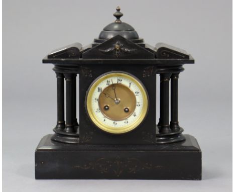 A late 19th/early 20th century mantel clock with two-part dial &amp; in black slate architectural case, 12½” high.
