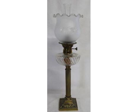 Victorian style brass oil lamp with reeded column, clear glass reservoir and etched glass shade