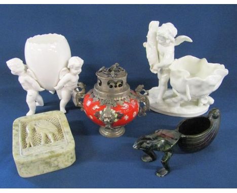 Blanc de Chine Minton (mark very faint) cherub table salt and an unmarked Cherubs carrying an egg shell, also a metal mounted