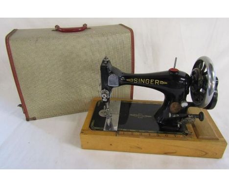 Hand crank Singer sewing machine with bobbin in place&nbsp;