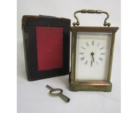 Cased brass carriage clock with key approx. 11cm tall to top of clock