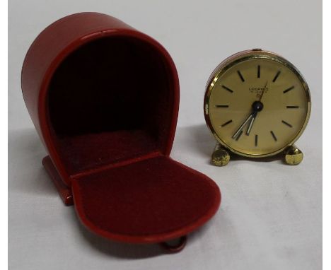 Vintage Looping travel alarm clock with Swiss 15 jewel movement, with red and brass band decoration in red case 45mm wide