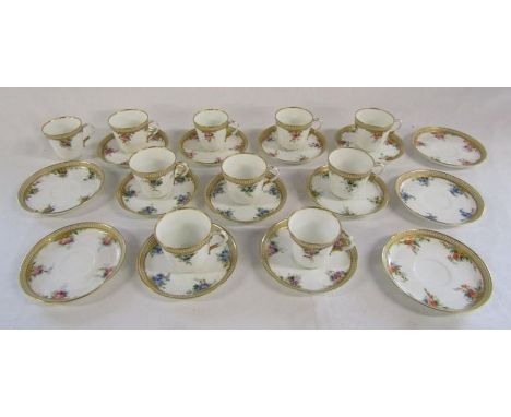 Hand painted collection of cups and saucers with flower pattern and gilding, marked in red 8197 to base and illegible indenta