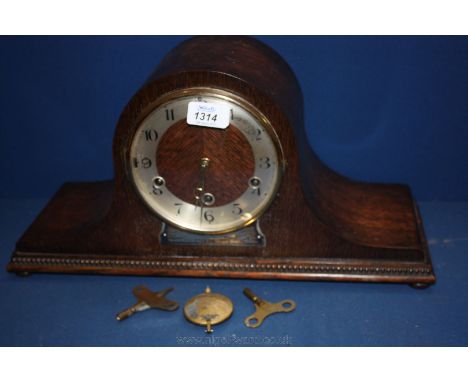 A Westminster chiming, Napoleon style Mantle Clock with keys and pendulum.