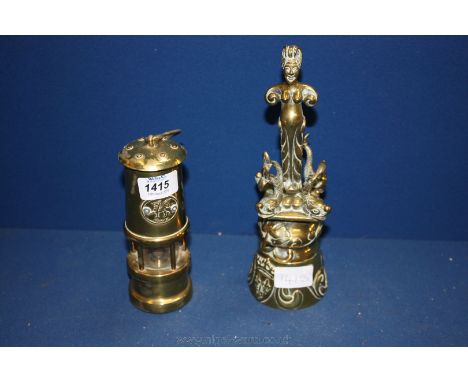 A small Brass Miner's Lamp and a decorative Brass Bell