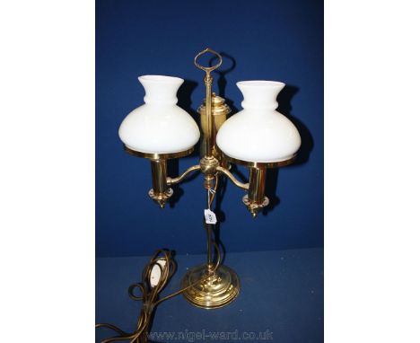 A Brass double Desk Lamp with white glass shades.