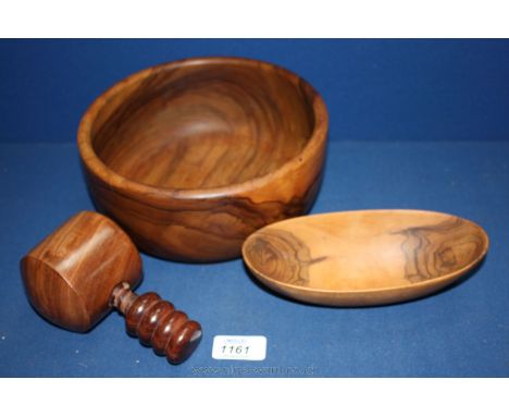 A turned wood Bowl, 8 1/4'' diameter, oval shaped bowl and a wooden nutcracker.