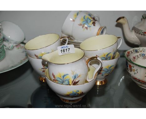 A Gladstone part Teaset including six cups, saucers and tea plates, bread and butter plate, sugar bowl and milk jug.