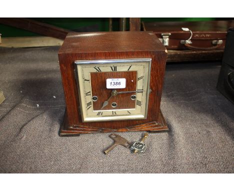 A square shaped Westminster chiming Mantle Clock with key and pendulum.