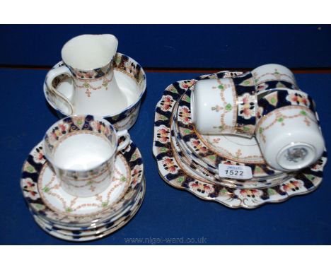 A part Victorian Teaset in floral blue and gilt decoration including cake plate, six saucers and tea plates, four cups, milk 