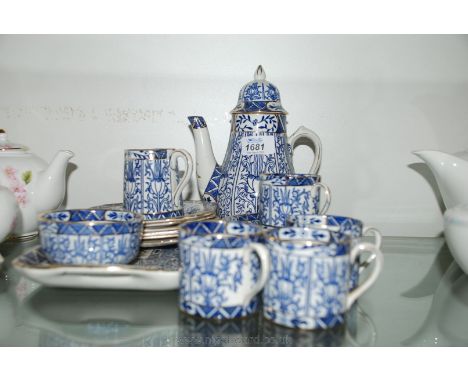 A blue and gilt part Coffee set by H.G.H.J. Stoke on Trent, Wilton Lily pattern no. 735940 including coffee pot, four coffee 