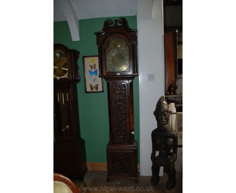A Georgian Oak longcase eight day Clock having swan pediment to the hood, also having fluted column supports flanking the sin