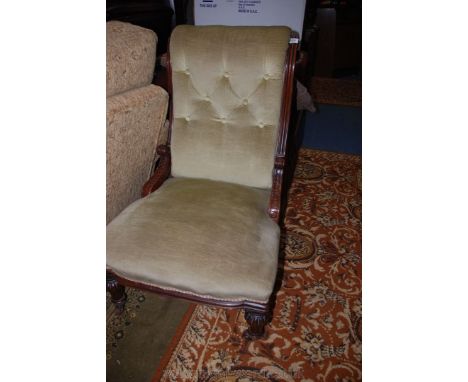 A Victorian Salon Chair having carved and shaped back supports, moulded frieze and turned reeded legs with castors, upholster