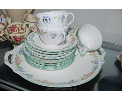A Royal Worcester part Teaset in 'English Garden' pattern including large bread and butter plate, six side plates and four cu