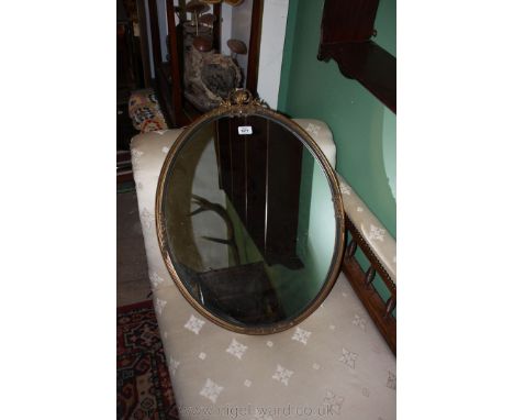 An oval gilt framed Wall Mirror.