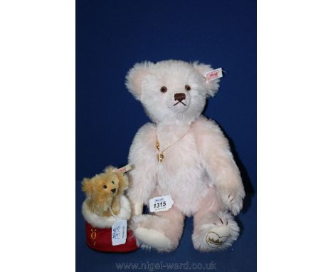 A pink Steiff Teddy Bear, 12'' tall together with a smaller Steiff bear, 4'' tall in a 2007 Christmas boot.