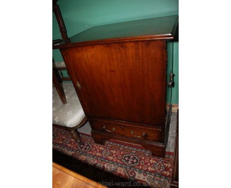 An unusual 19th c. Mahogany Cabinet, having moulded edge rectangular top over single panel door, opening to reveal a single s