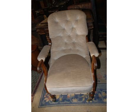 A good 19th c. salon Armchair having beige draylon button back upholstery with Mahogany arms with similar draylon pads and sc