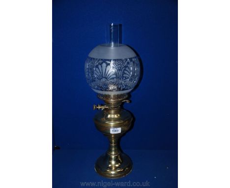 A Victorian Brass Lamp with etched glass shade and chimney