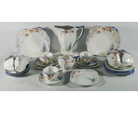 A Shelley Queen Anne Tea service of octagonal shape, including eleven cups, nine saucers, ten tea plates, cake plate, bread a