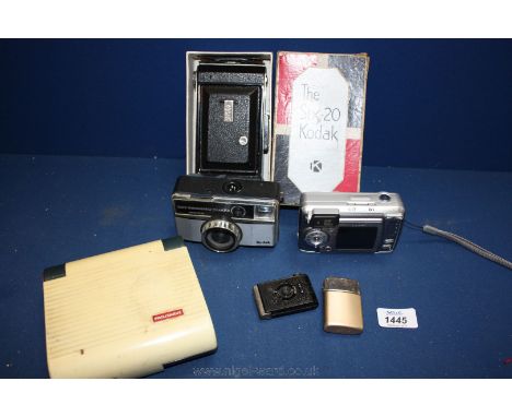 A Mugette Cigarette Lighter in the form of a camera, Ronson Typhoon lighter, Philishave travelling battery Shaver, and three 